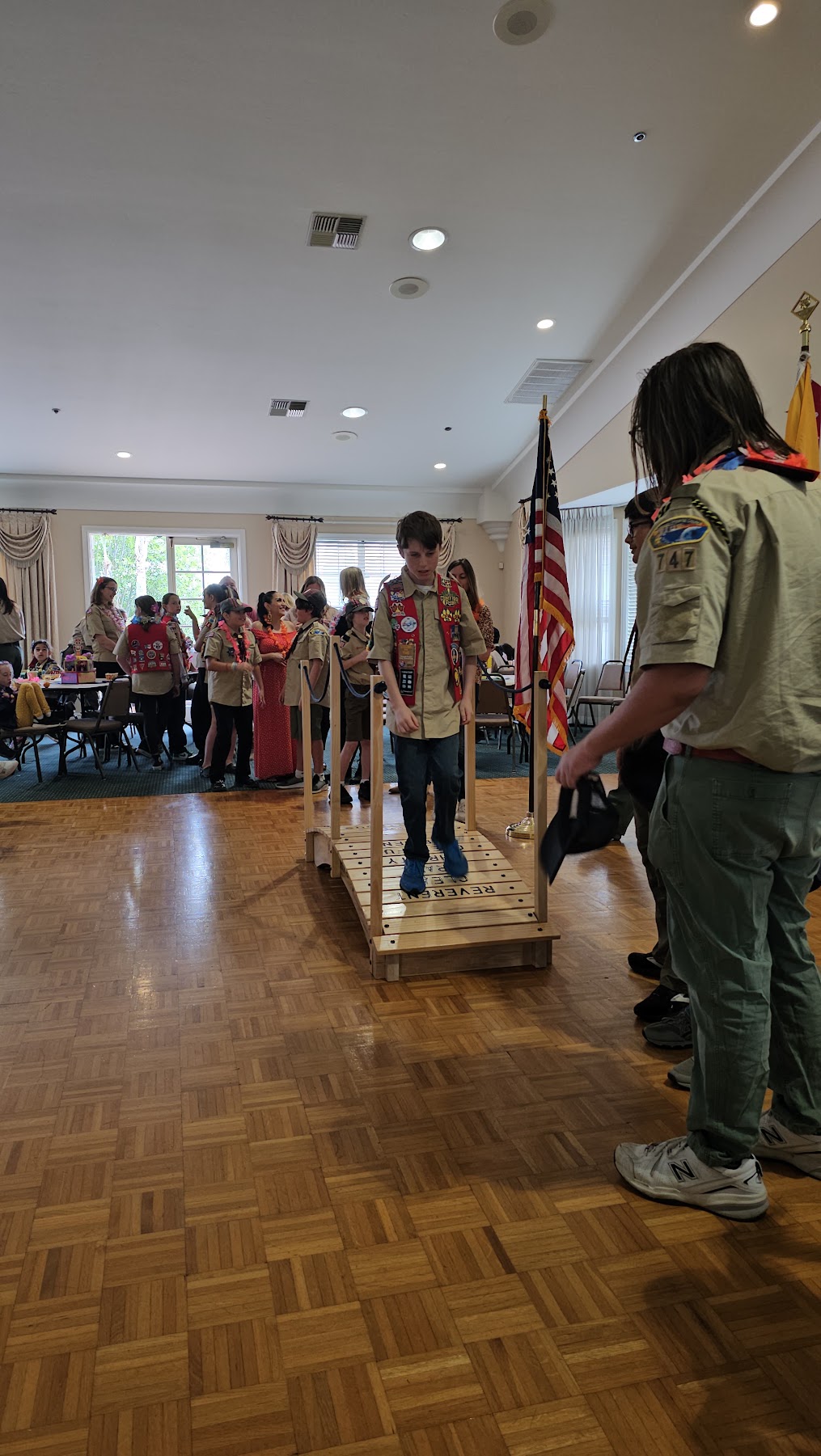 Scout participating in a bridge ceremony