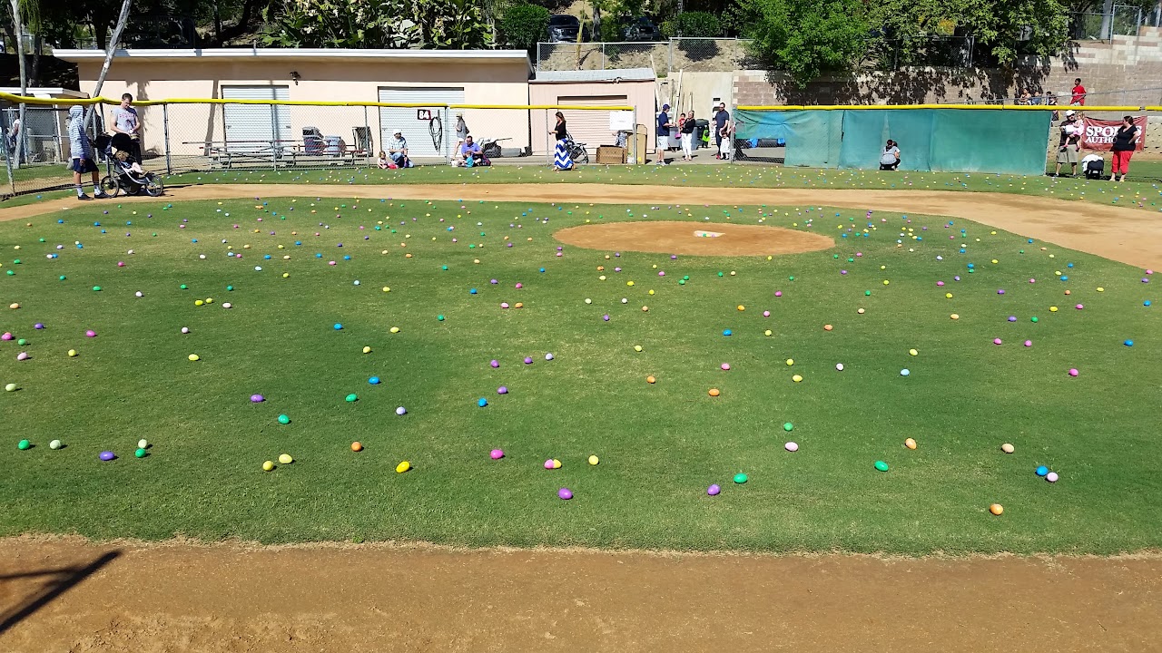 Colorful Easter eggs spread across the ballfield before the egg hunt
