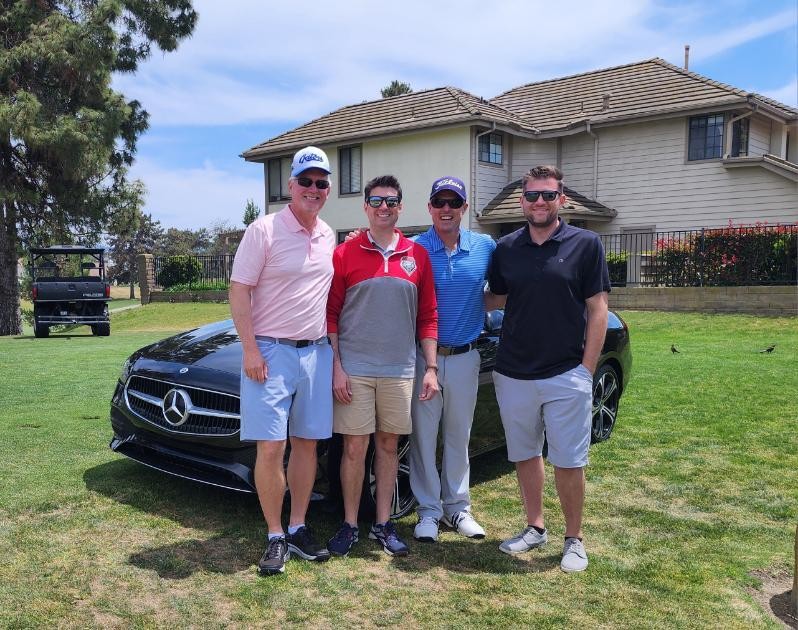 Hole-in-one winner and fellow golfers at the Larry Cooke Memorial Golf Tournament