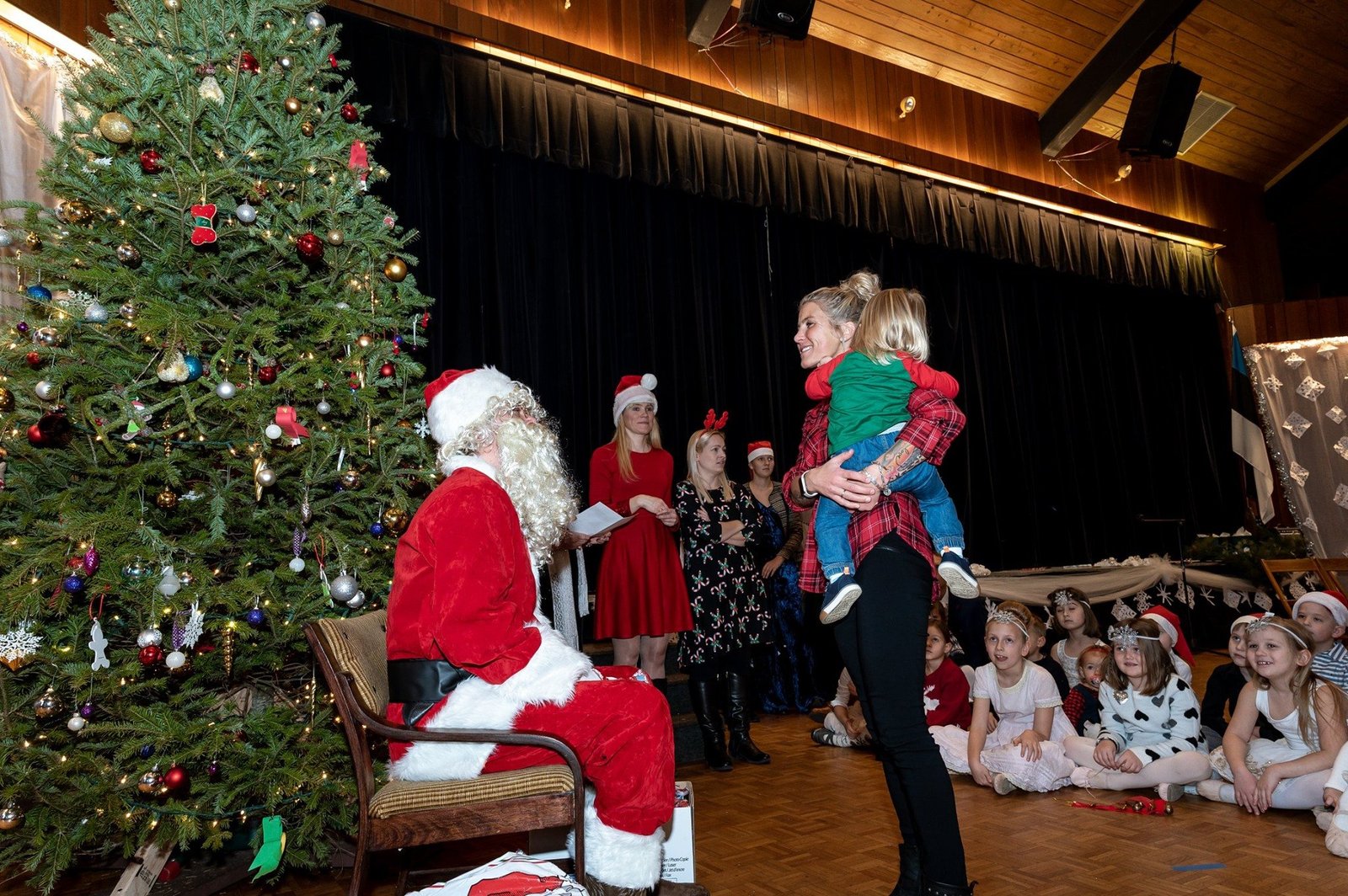 Children gathering with Santa at a community celebration